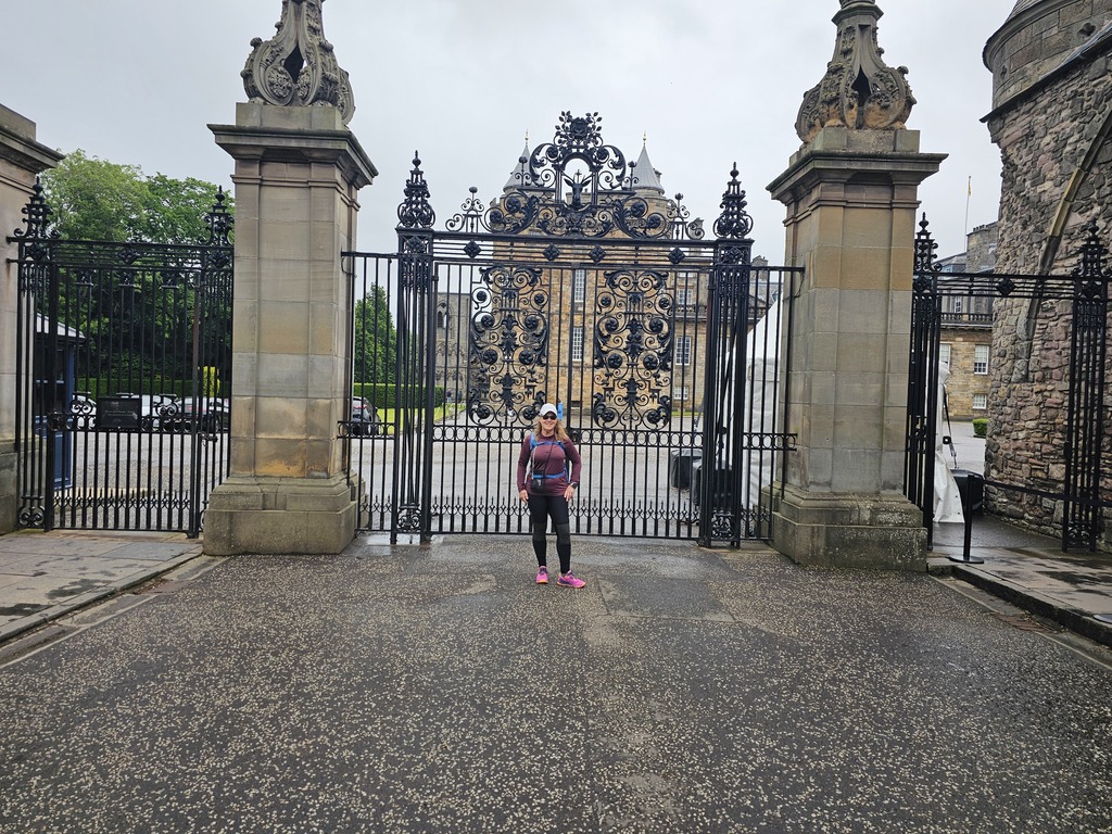 Tracy standing in front of an ornate gate