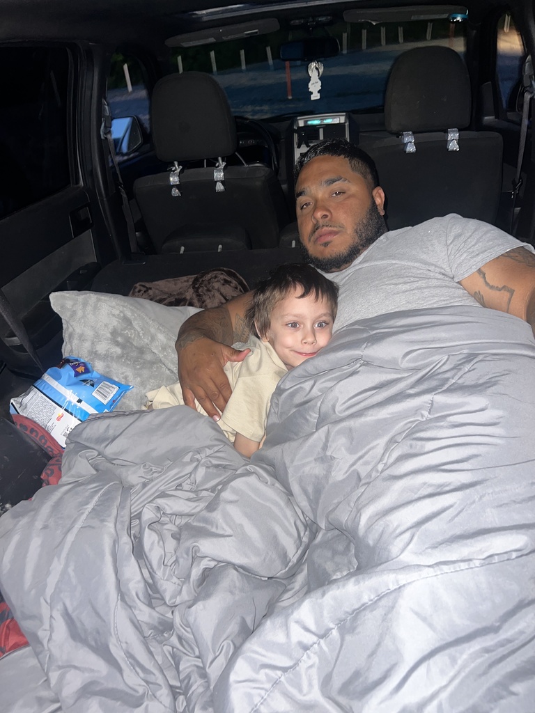 Axl watching the movie with the back of the car
