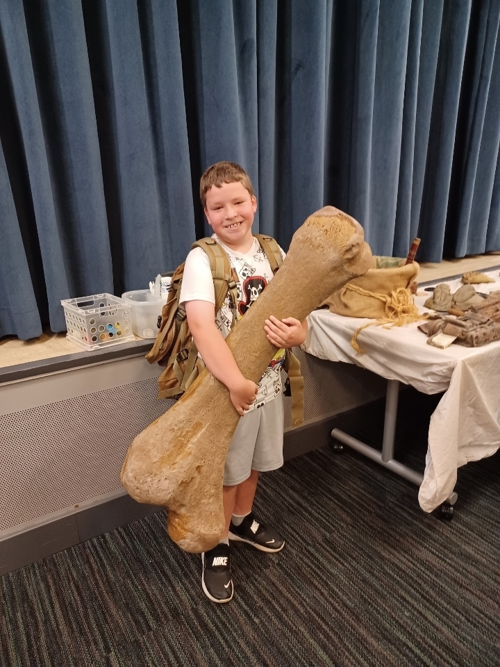 Sawyer holding a giant bone