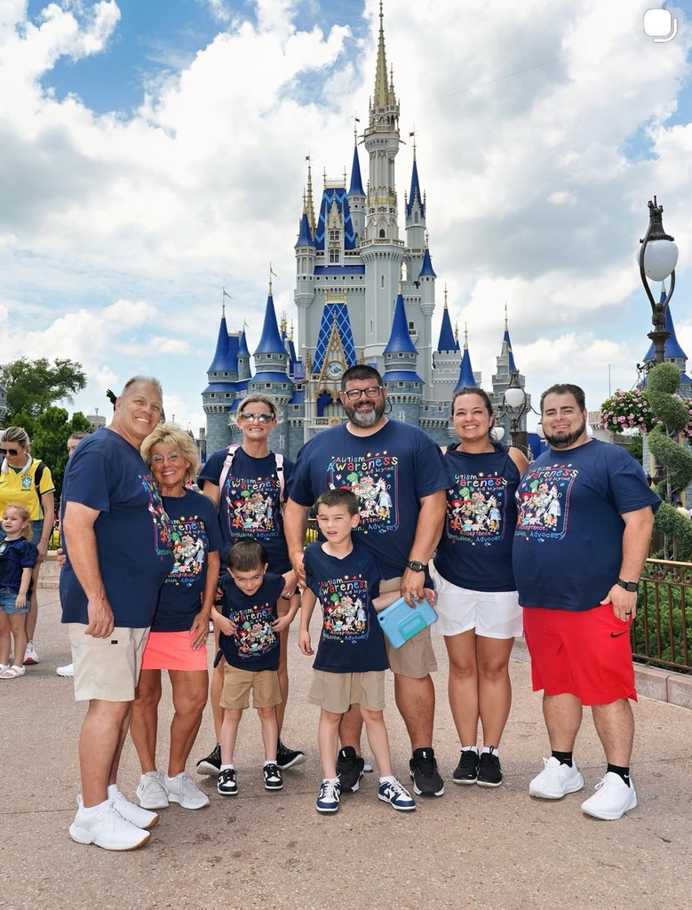 Nick and Jake standing in front of the castle with his parents, grandparents and uncle and aunt