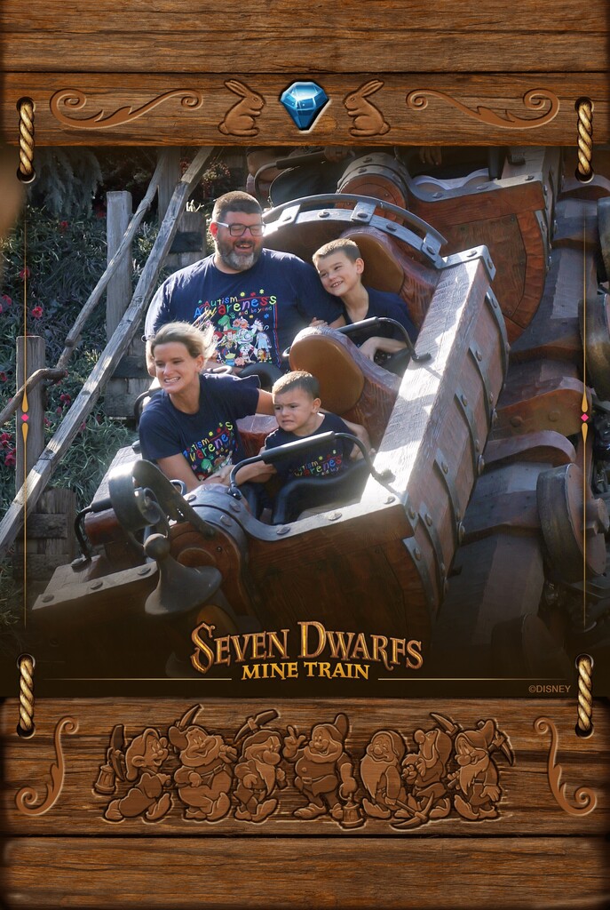 Nick and Jake wit their parents in the Seven Dwarfs Mine Train ride