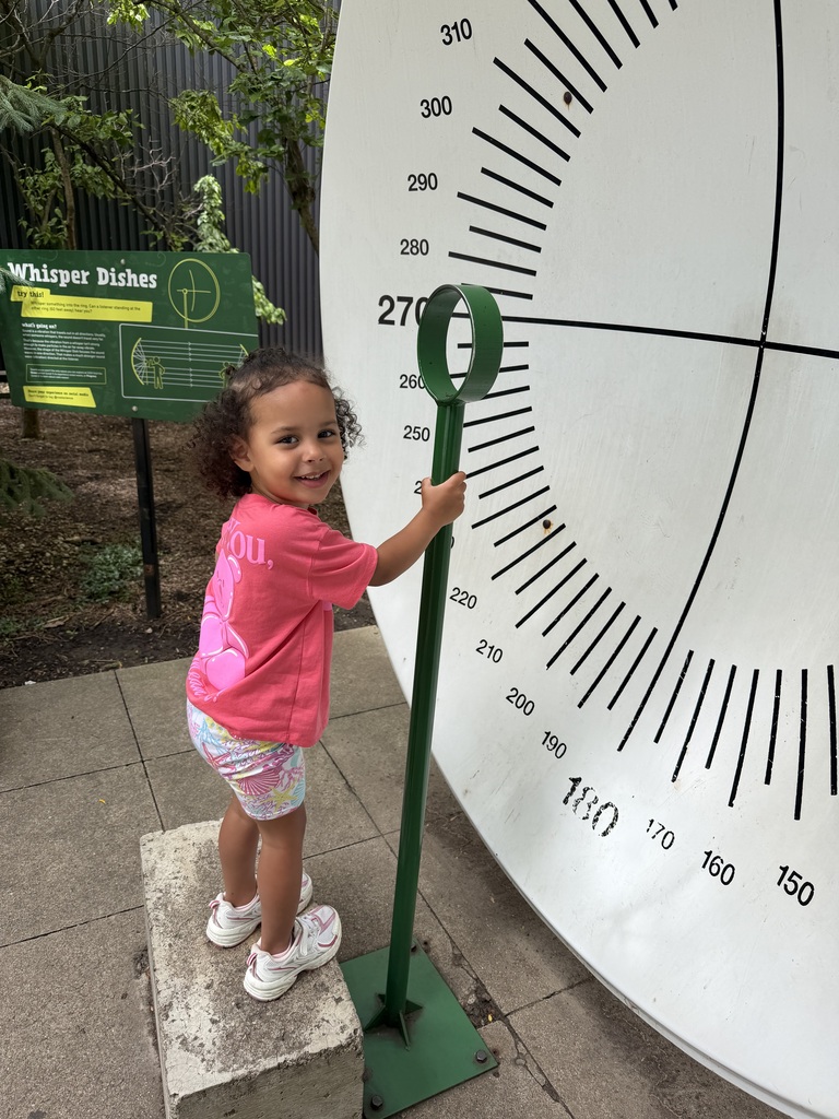 Taleah standing on a big scale
