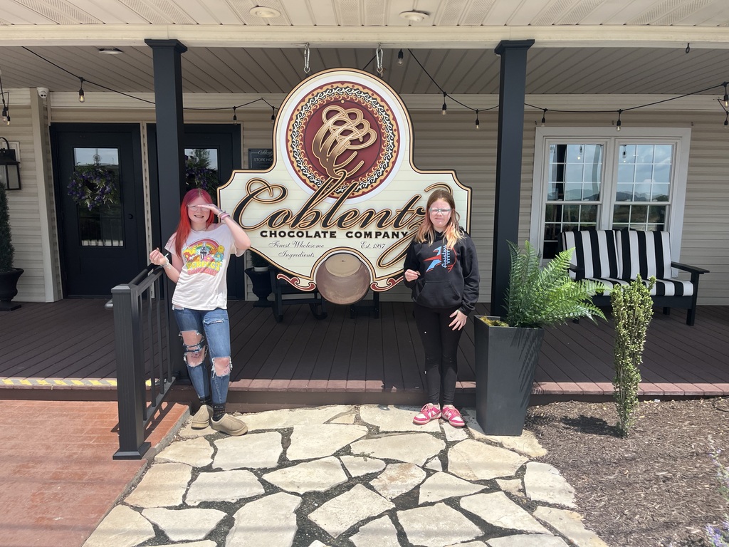 The students standing in front of the coblentz sign