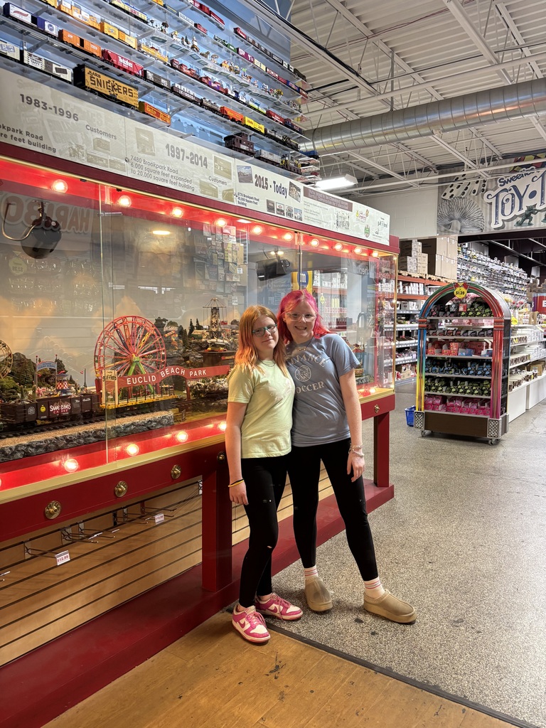 The students standing in front of the sweets counter