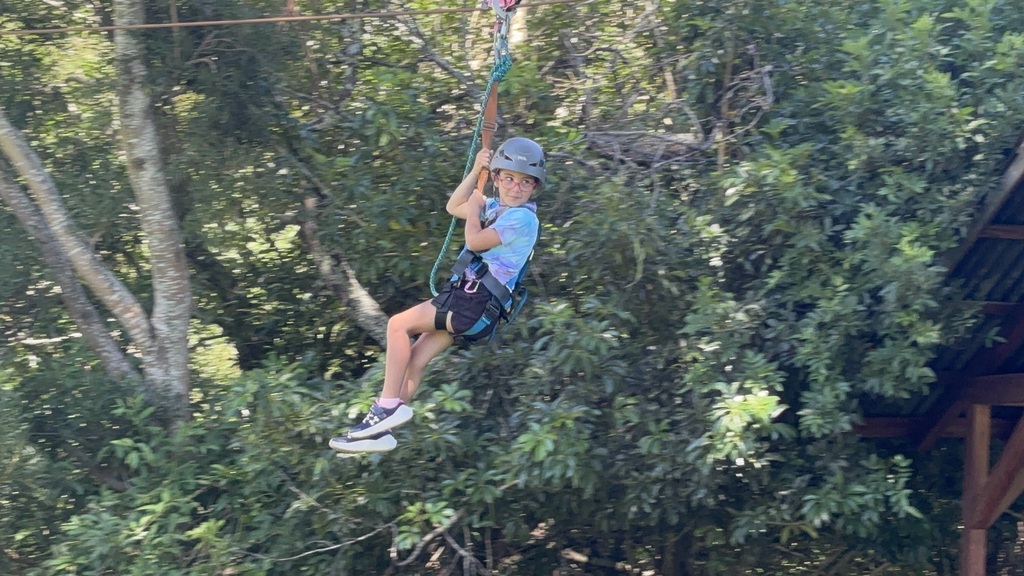Emi ziplinging through the trees