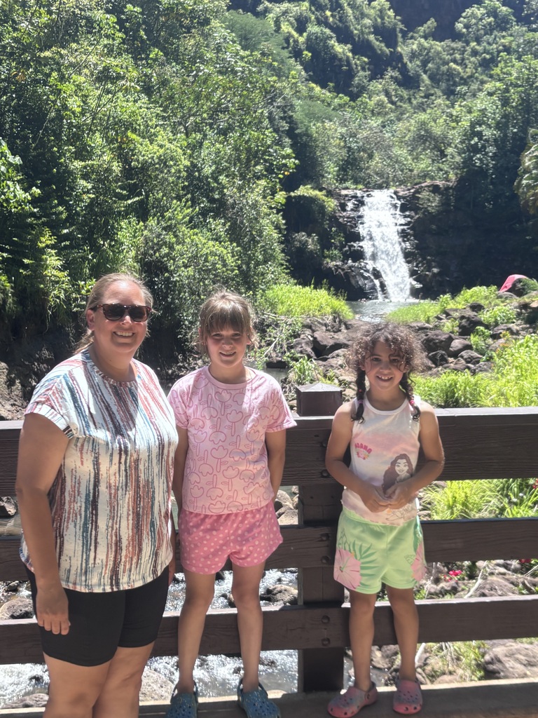Amanda, Ella and Emi standing in front of the waterfall