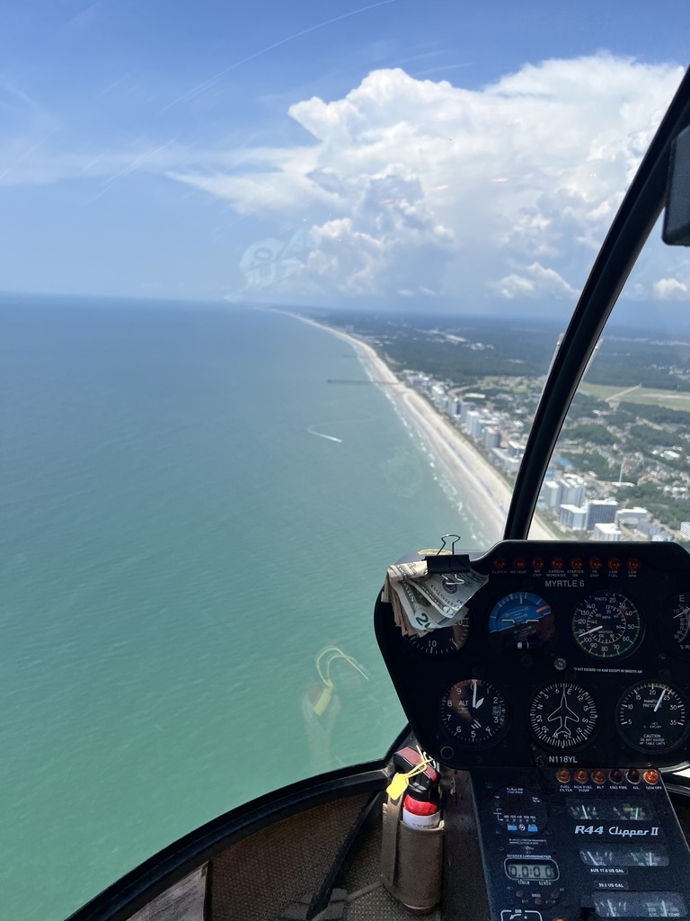 A view of the ocean and the shore from the helicopter