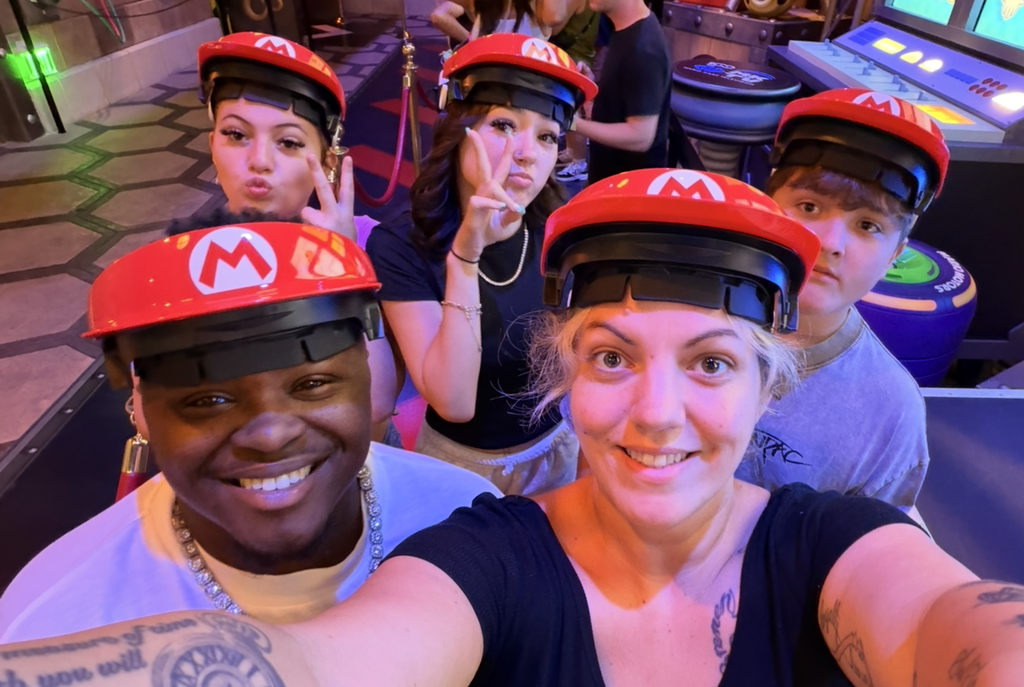 The family wearing hats like the character Mario wears in the video game