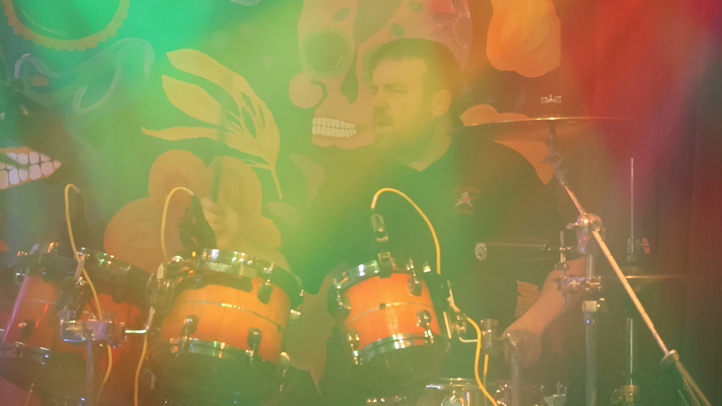 Eric Peters playing the drums on stage