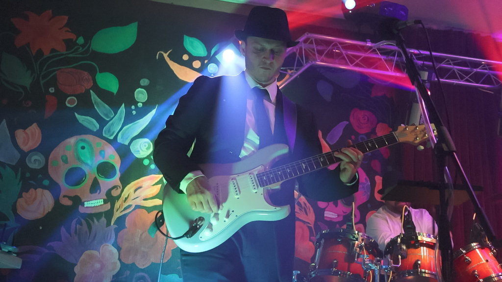 Steve cabassa playing the guitar on stage