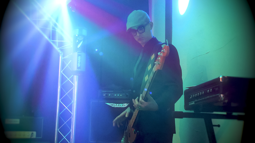 Alumni Joe Pisanello playing the base on stage