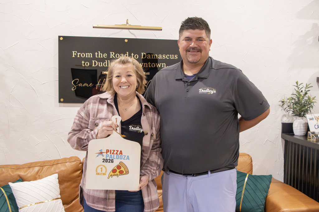 Two adults hold the award for pizza palooza