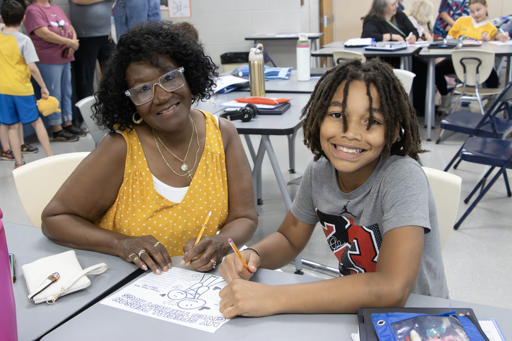a grandmother smiles with her grandson