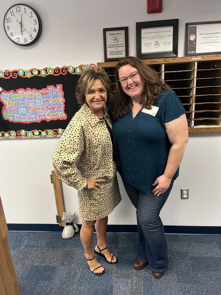 Mariah standing with Lori Gasparik. Both are smiling for the picture