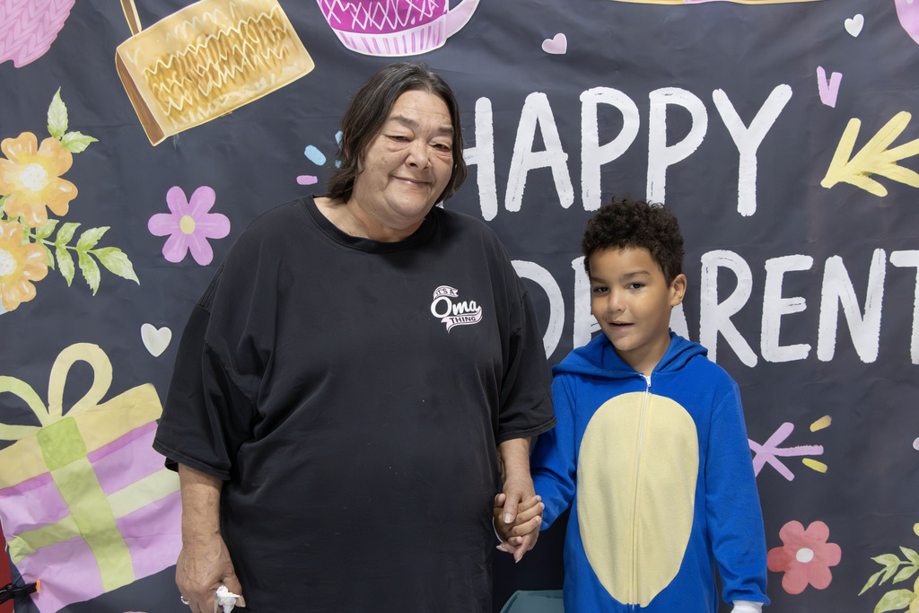grandparent smiling with their grandchild