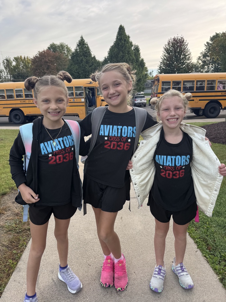 three students wear matching black shirts with Aviators class of 2036 on them