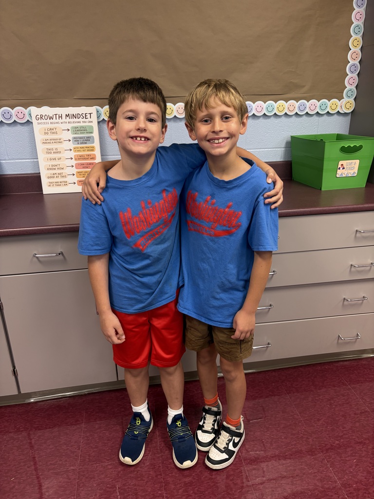 twi students dressed alike in matching blue shirts