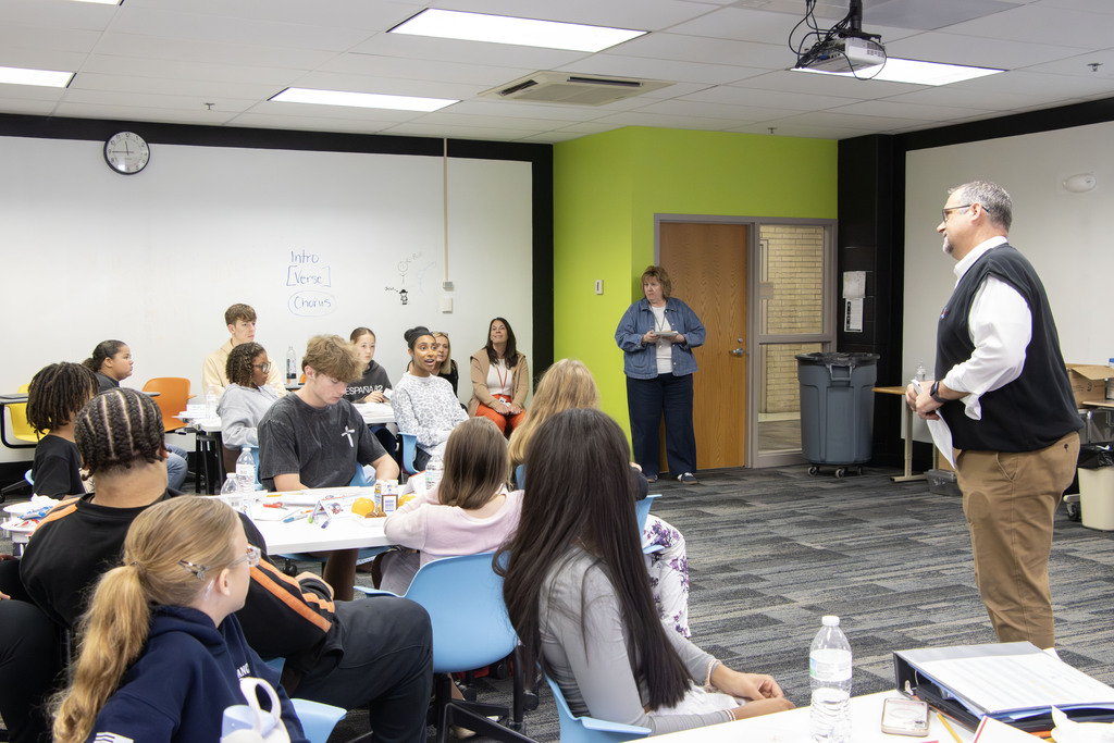 Mr. Gress speaks to a room full of students