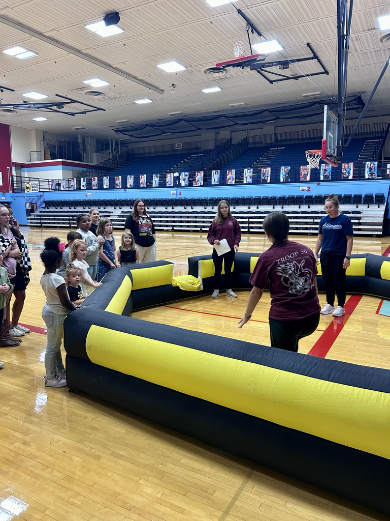 Students learn how to play gaga ball in the gym