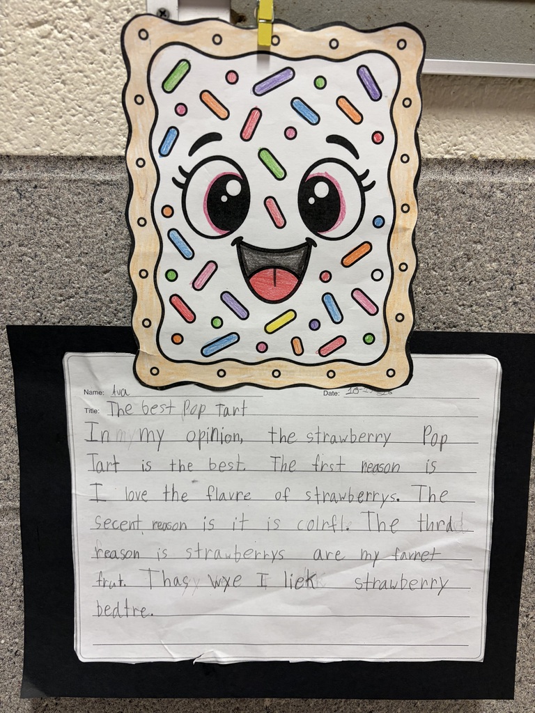 A student's handwritten opinion-writing assignment titled “The Best Pop Tart” is displayed on black paper beneath a colorful drawing of a smiling Pop-Tart. The Pop-Tart drawing has white frosting, multicolored sprinkles, large eyes and a smiling mouth. The student's writing reads: Name: Ava Title: The best Pop tart "In my opinion the strawberry Pop Tart is the best. The first reason is I love the flavor of strawberries. The second reason is it is colerfl. The third reason is strawberries are my favorite fruit. That why I like strawberry better."