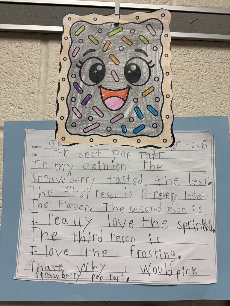 A student's handwritten opinion-writing assignment titled “The Best Pop Tart” is displayed on blue paper beneath a colorful drawing of a smiling Pop-Tart. The Pop-Tart drawing has gray frosting, multicolored sprinkles, large eyes and a smiling mouth. The student's writing reads: "The best Pop tart In my opinion the strawberry tasted the best. The first reson is I really loved the flavor. The second reson is I really love the sprinkls. The third reson is I love the frosting. thats why I would pick strawberry pop tart."