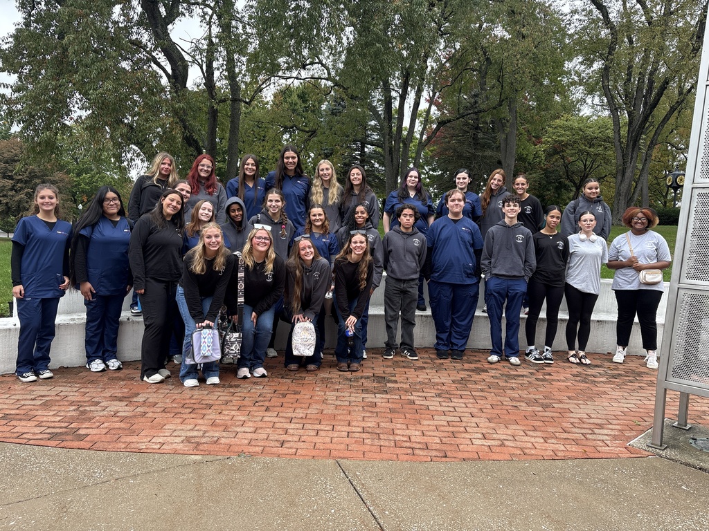 All the pre med students pose for a photo on the college's campus
