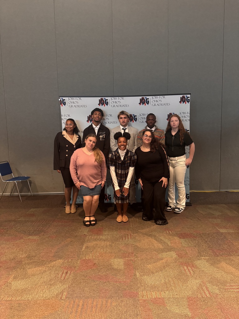All the Alliance High School Job for Ohio Graduate students stand for a picture in front of the JOG backdrop