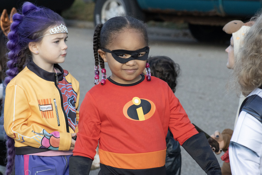 A student walks in the parade dressed as Mrs. Incredible