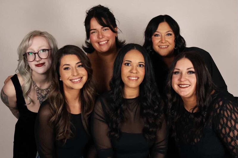 group photo of all the stylists at her salon that graduated from Alliance High School