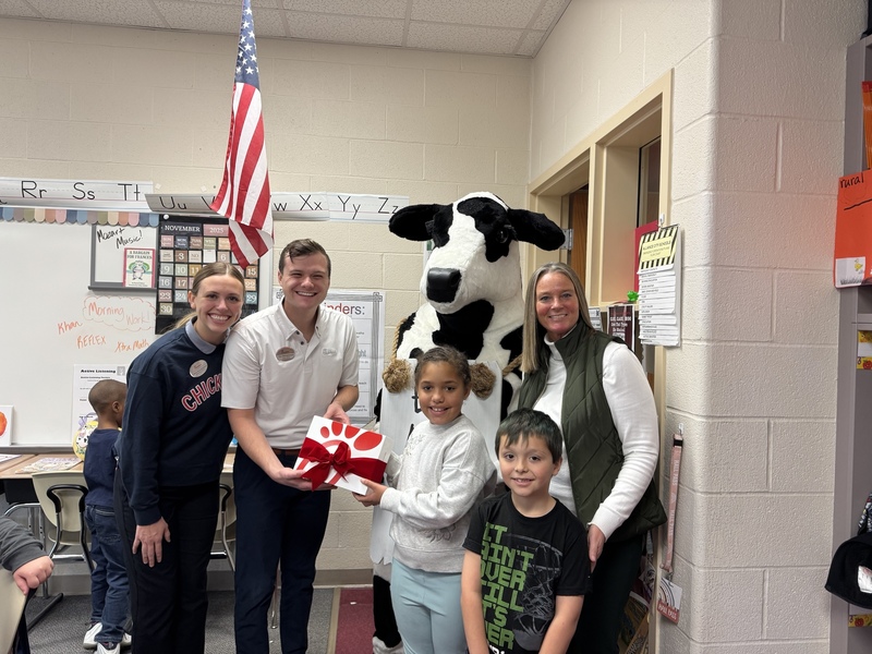 Chick Fil A Cow delivering meals to students