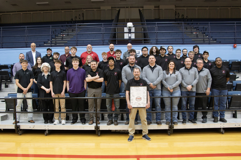 group picture of all the students who signed career commitments along with their instructors and emplyers