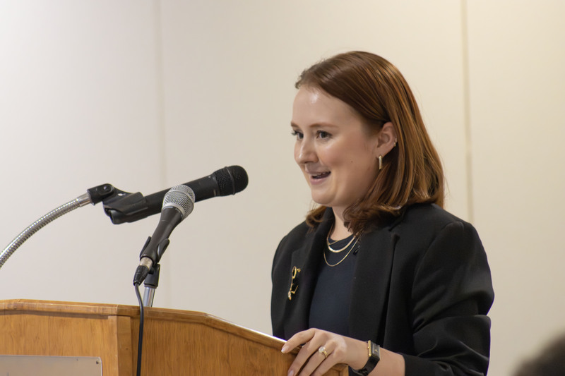 Picture of Paige Felger speaking at a podium