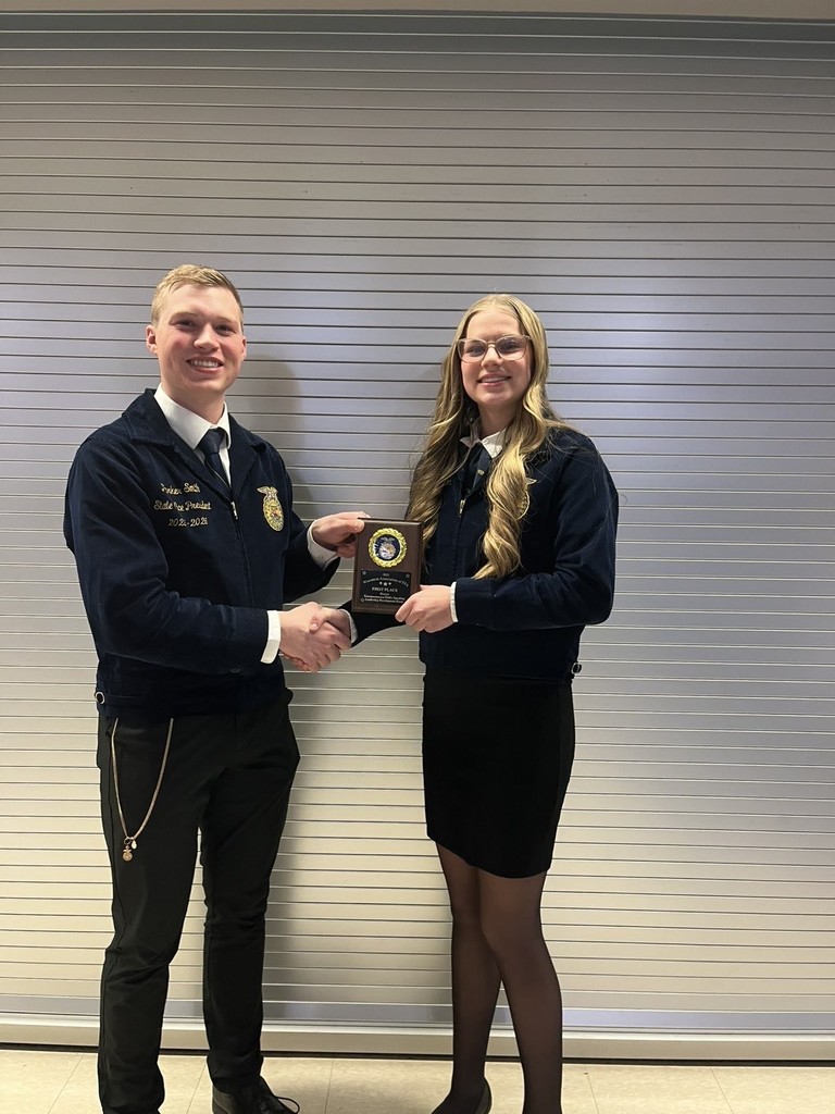 Success in the Extemporaneous Public Speaking event! Here, our first-place winner receives her plaque from the State Vice President. Thinking on your feet and communicating clearly is what leadership is all about.