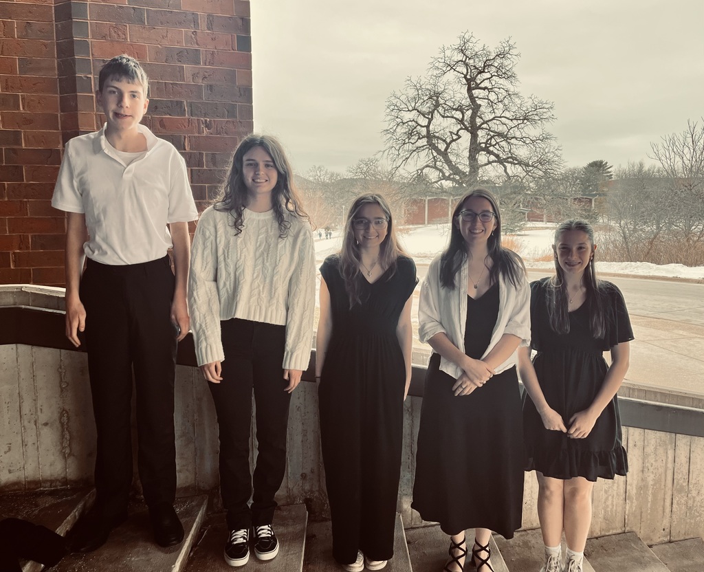 Pictured are five students from Alma and Pepin High School dressed in black and white standing outside of the CFL at Luther College in Decorah, Iowa.