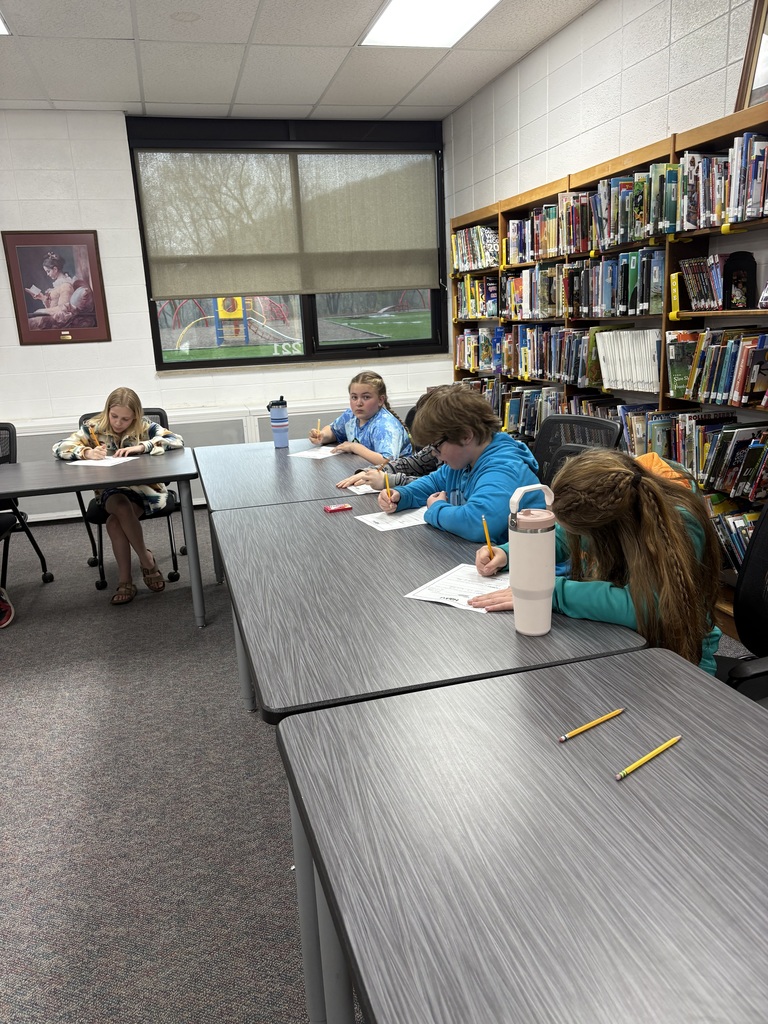 A group of four students writing their own poetry!