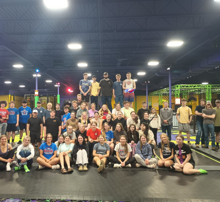 Picture of lots of kids smiling at Air Insanity trampoline park for after prom. 