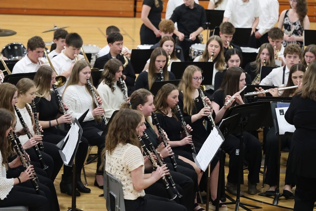 Picture of High School band kids playing wearing black and white. 