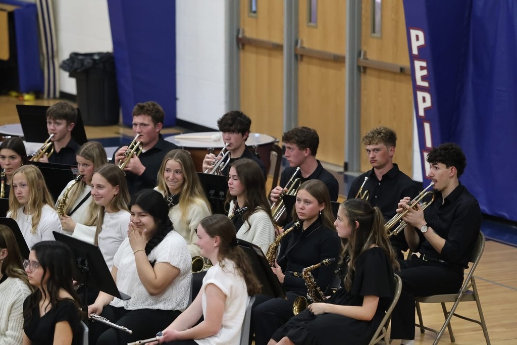 High school band playing wearing black and white
