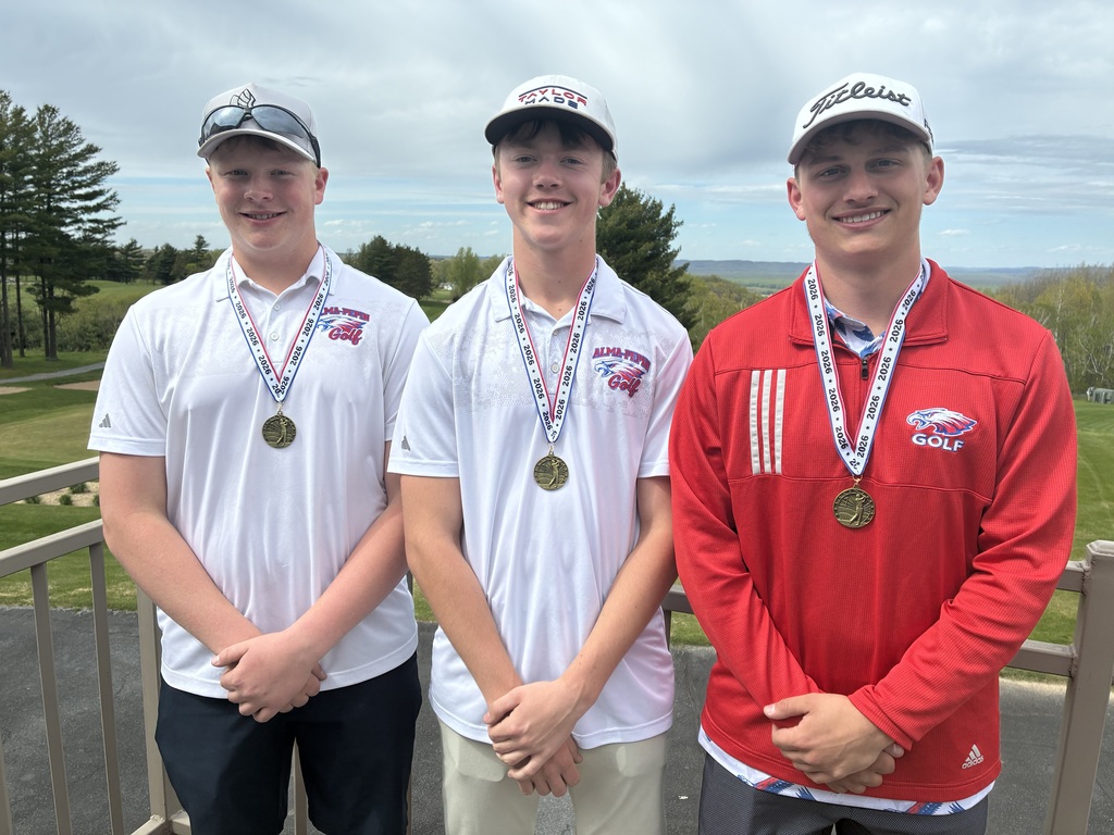Wil Jumbeck, Anders Johansen, and Trenton Krzoska smiling with medals at the Alma Invite. 