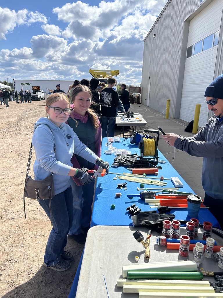 A photo of Emma, and Sarah using products for fiber optic piping. 