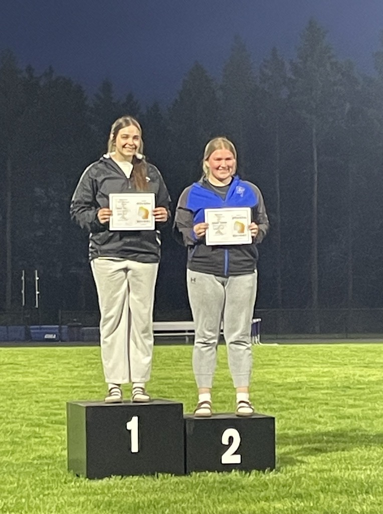 Nessa Noll smiling on the podium. 
