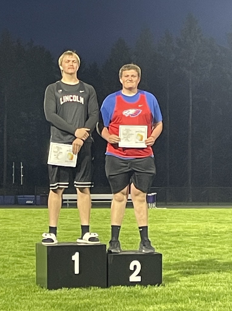 Breckin Hullopeter smiling on the podium. 