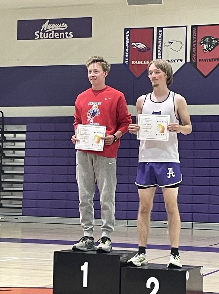 Griffin Reisgraf smiling on the podium. 