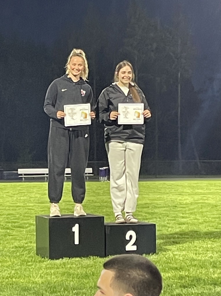 Nessa Noll smiling on the podium. 