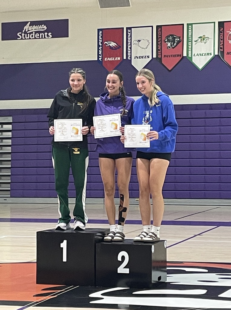 Macy Stewart smiling on the podium. 