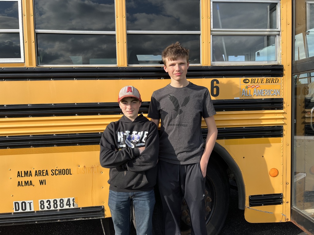 Two Alma Pepin golfers smiling at the camera. 