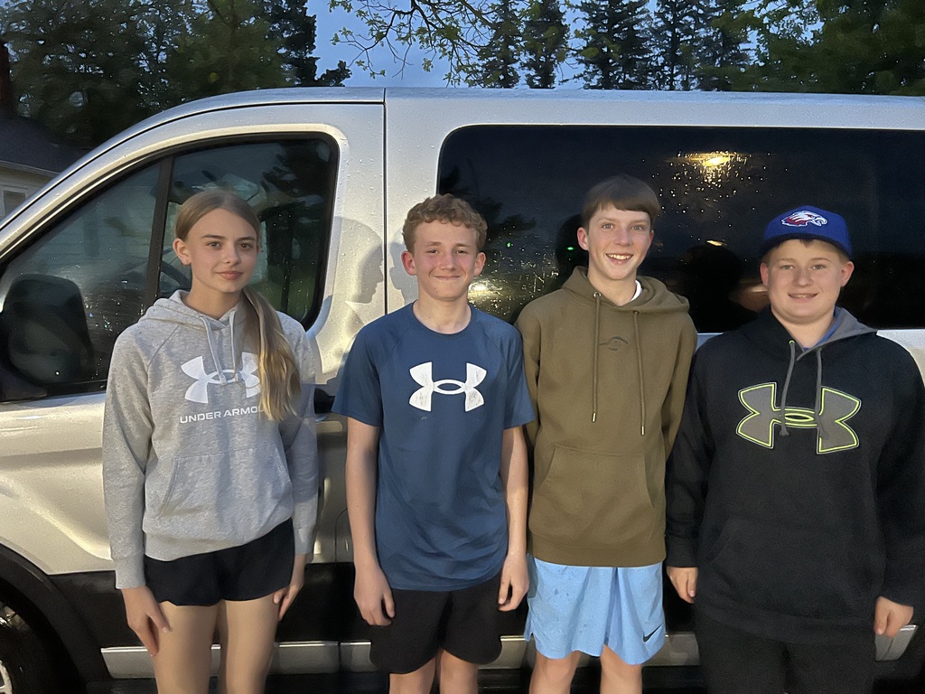 Four Alma Pepin golfers smiling at the camera. 