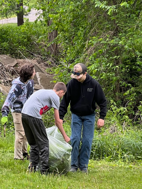 Kids picking invasivie species