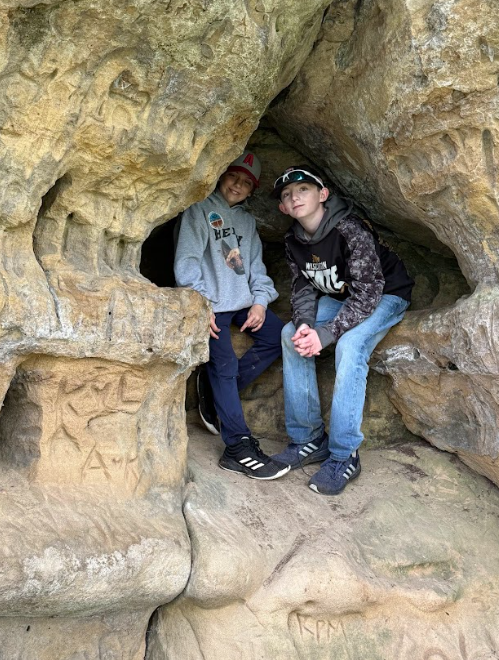 Kids posing in a rock