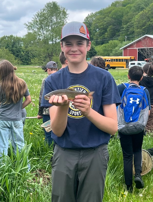 Magnus holding a trout
